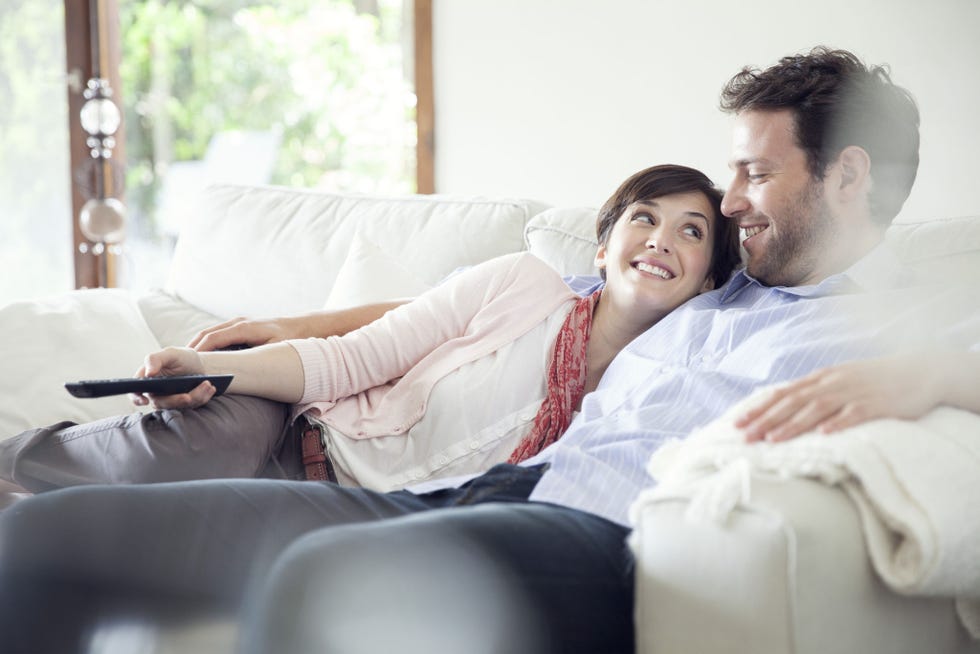 Photograph, Skin, Sitting, Happy, Furniture, Room, Photography, Couch, Electronic device, Comfort, 