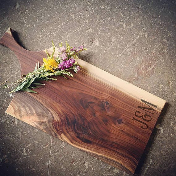 Wood, Flower, Wood stain, Leaf, Plant, Floor, Floral design, Hardwood, Cutting board, Still life photography, 