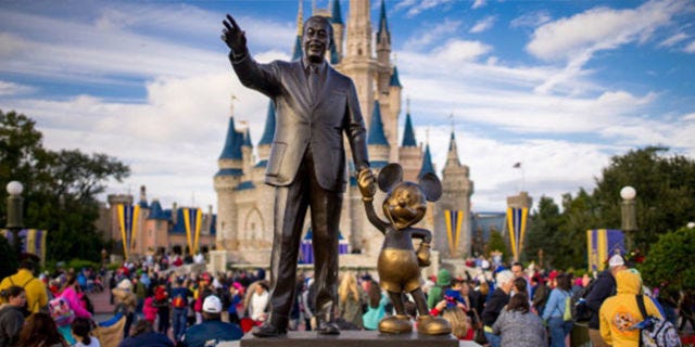 Statue, Walt disney world, Landmark, Monument, Amusement park, Park, Tourism, World, Sculpture, Tourist attraction, 