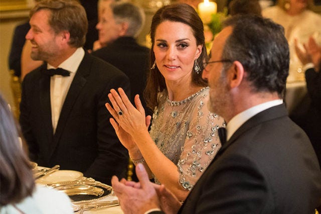 Event, Yellow, Conversation, Interaction, Formal wear, Suit, Businessperson, Hand, Gesture, Ceremony, 