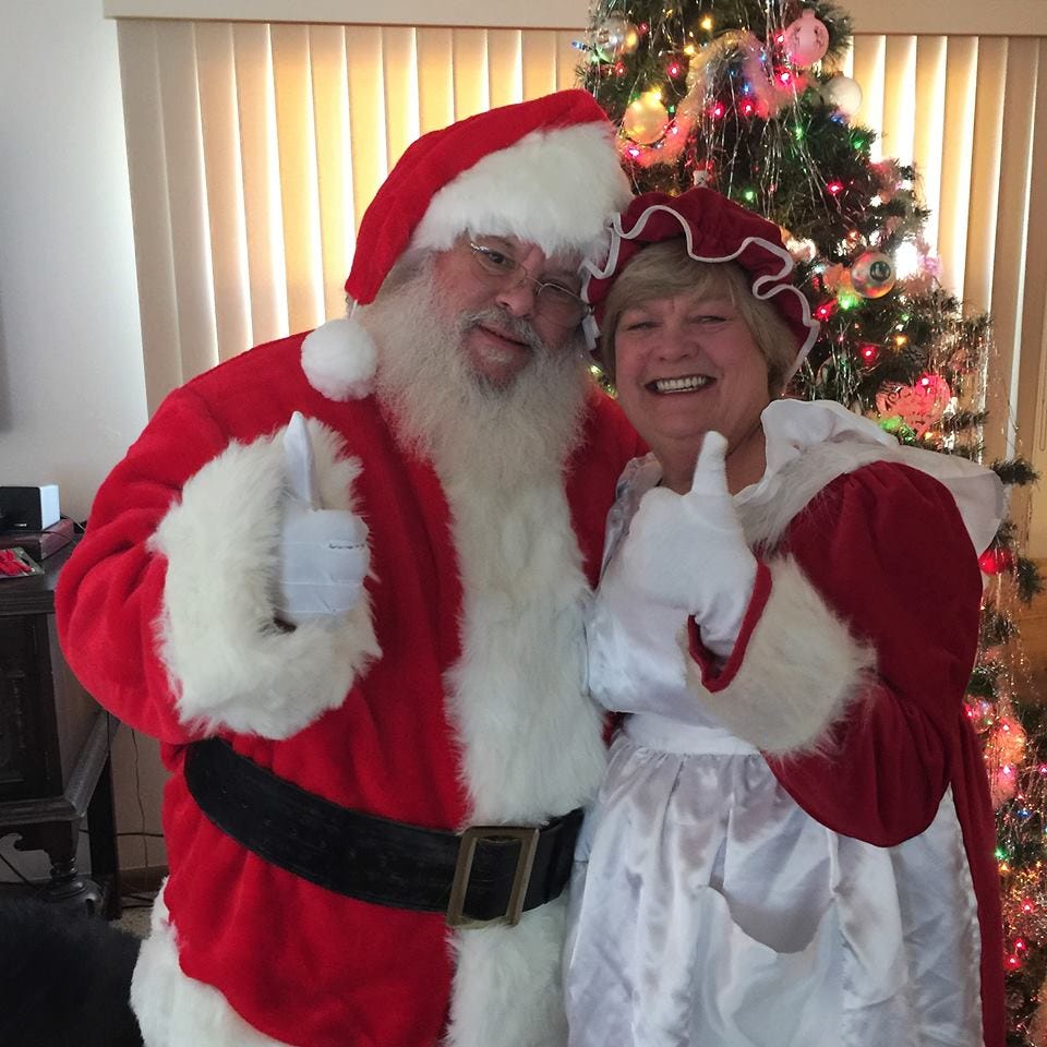 Santa claus, Christmas, Christmas eve, Fictional character, Lap, Facial hair, Holiday, Human body, Event, Tradition, 