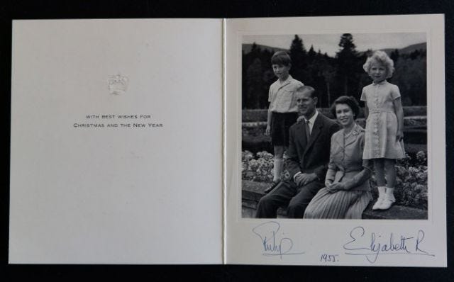 A photograph from a Christmas card dated 1955 showing Queen Elizabeth II and the Duke of Edinburgh alongside children Prince Charles and Princess Anne.