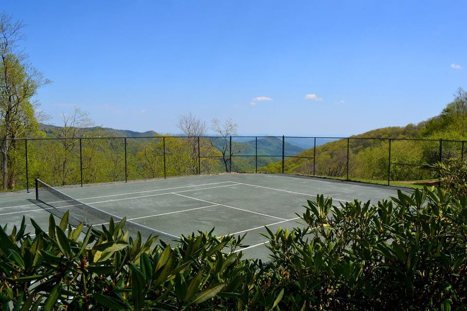 tennis court, sport venue, property, sky, grass, leaf, real estate, tree, house, land lot,