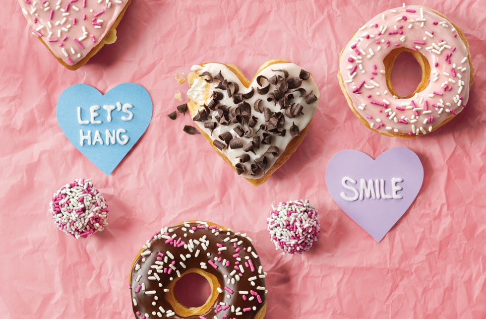 Pink, Heart, Sweetness, Doughnut, Food, Fashion accessory, Valentine's day, Baked goods, Sprinkles, Pastry, 