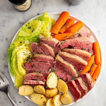 corned beef and cabbage plated with boiled potatoes and carrots