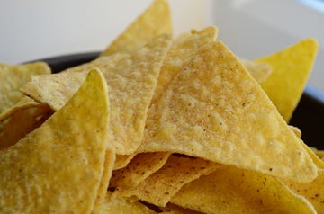 Food, Cuisine, Tortilla chip, Corn chip, Dish, Totopo, Junk food, Nachos, Ingredient, Snack, 