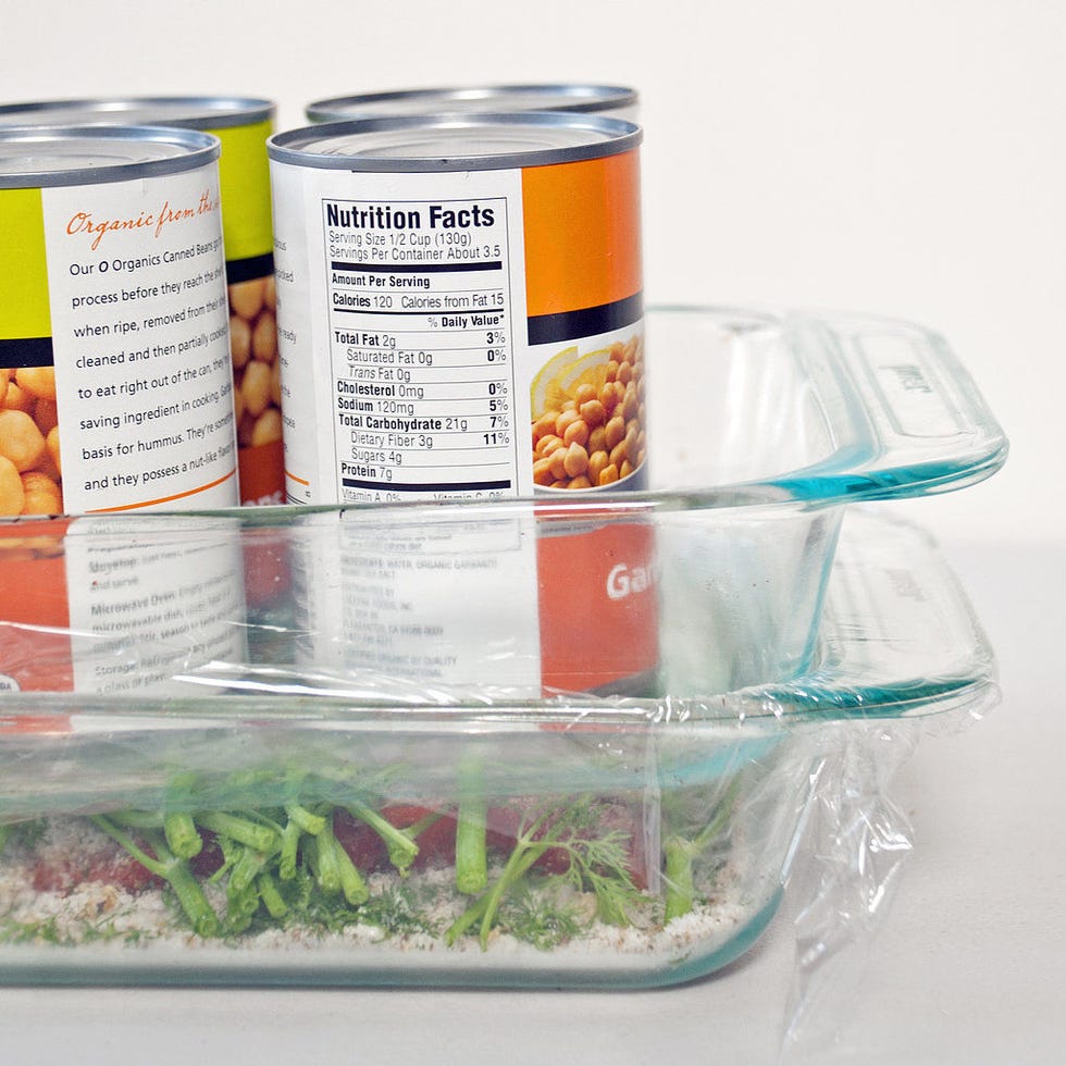 <p>For firmer gravlax, loosely cover the dill-topped salmon with plastic wrap, top it off with another equal-size (or smaller) baking dish, and weigh it all down with canned goods, pie weights, or loose change.</p>