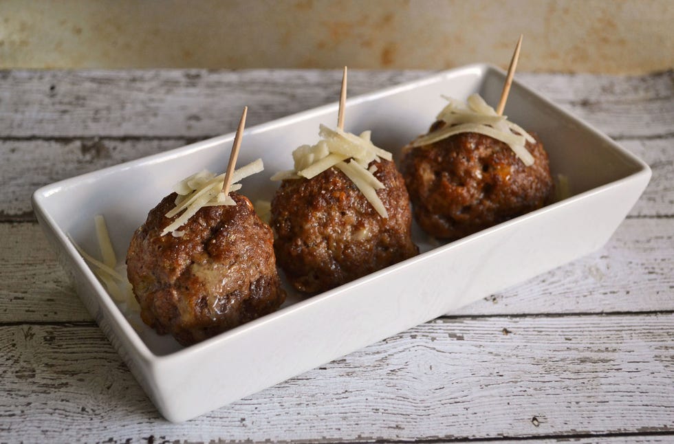<p>Whereas meatballs are usually made in a slow cooker or frying pan, this recipe calls for baking them in the oven, which preserves a soft and moist inside but provides a crispier texture on the outside. You main challenge will be waiting until the guests arrive to start popping them in your mouth.</p>
<p>Get the recipe at <a href="http://savvysavingcouple.net/2013/09/12/gluten-free-meatballs-recipe/">Savvy Saving Couple</a>.</p>