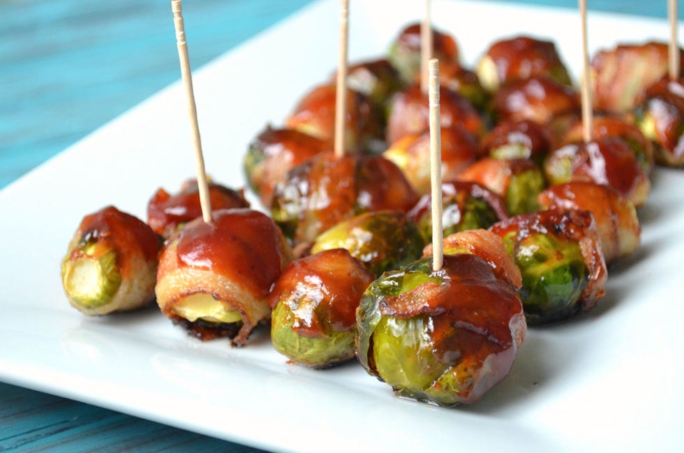 <p>Add tangy barbecue sauce to these quick apps, or serve them plain—well, as plain as a bacon-wrapped food can be.</p><p>
<strong>Get the recipe at <a href="http://www.the-savvy-kitchen.com/2013/08/bbq-bacon-wrapped-brussels-sprouts.html" target="_blank">The Savvy Kitchen</a></strong>.</p>