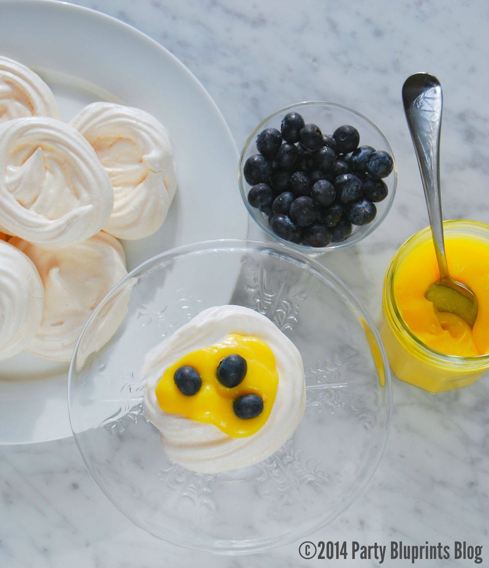 <p>Let these simply charming confections add a special touch to your Easter table. These light and airy meringue nests filled with luscious lemon curd and topped with bright blueberries are a sweet grown-up treat.</p>
<p><a href="http://www.partybluprintsblog.com/the-menu/dessert/lemon-meringue-nests-spring-dessert/" target="_blank"><strong>Click for the recipe.</strong></a></p>