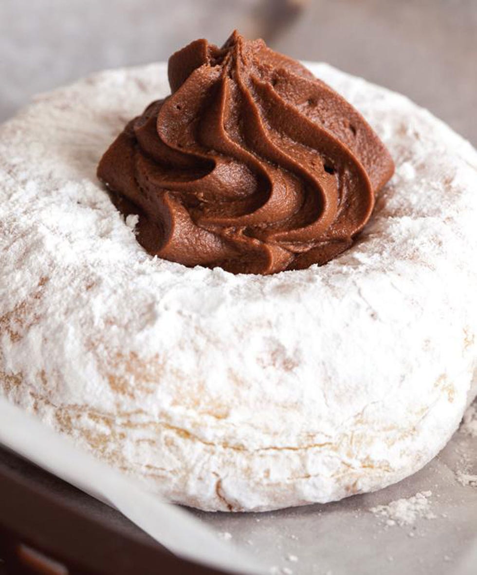 <p>Cream filling is to doughnuts as cheesecake is to cake: intimidating to make, but <em>so</em> worth it when you get to sink your teeth into the homemade creamy chocolate center.</p>
<p><strong>Donut</strong></p>
<p>1 lb + 13 oz flour</p>
<p>4 oz sugar</p>
<p>¼ oz baking powder</p>
<p>½ oz salt</p>
<p>1½ oz yeast</p>
<p>1 lb milk, scalded</p>
<p>3 oz unsalted butter</p>
<p>4 oz (approximately 2) eggs</p>
<p>Oil</p>
<p>Place dry ingredients in a large bowl; set aside for later use. </p>
<p>Place wet ingredients in a bowl. Pour dry ingredients on top of wet ingredients, adding yeast last. Using a stand mixer on low speed, mix until dough is homogenous, 1 minute. Turn the mixer to medium speed and mix just until dough can be stretched to the point you can begin to see through it, but it has not broken, 10 to 12 minutes.</p>
<p>Remove dough from the bowl. Lightly ball it up place on a floured work surface, then let it relax, 5 minutes. Begin rolling the dough, starting from the center, until it is approximately ¾ inch thick. Allow dough to rest, 5 minutes.</p>
<p>Cut out shapes and/or hand-shape as desired. Place doughnuts on a tray or screen. Proof by spraying with a water bottle. Place a moist towel over doughnuts. Leave to rest at room temperature, 30 minutes to one hour.</p>
<p>Pour oil to a depth of 3 inches into an electric fryer or deep saucepan and heat to 370°F. Working with a stick and a skimmer, drop three or four doughnuts into the oil. Let sit, 90 seconds. Gently flip each doughnut using the stick and allow the other side to fry, 90 seconds. Pick up doughnuts with the skimmer. Place on paper towels or a rack to cool and drain.</p>
<p><em>Makes 12 to 15 doughnuts.</em></p>
<p><em> </em></p>
<p><strong>Filling </strong></p>
<p>1 ¼ cups whole milk</p>
<p>3 egg yolks</p>
<p>¼ cup sugar</p>
<p>1 ½ tsp cocoa powder</p>
<p>2 tsp cornstarch</p>
<p>2 oz semisweet chocolate, melted</p>
<p>1 tsp vanilla extract</p>
<p>In a small saucepan, warm milk over low heat until it is just hot enough to steam. While milk is warming, whisk together egg yolks, sugar, cocoa powder, and cornstarch until mixture is completely smooth.</p>
<p>Once milk is steaming, add melted chocolate and whisk until it is fully incorporated. Add half of the chocolate milk, whisking constantly, to the egg mixture. </p>
<p>Add milk and eggs back into hot milk, continue stirring, and heat, 1 to 2 minutes, until custard reaches 170°F and is very thick. Remove from heat, stir in vanilla extract, cover with plastic, and chill before using.</p>
<p>Use a chopstick to poke a hole in a cooled doughnut and jiggle it to clear out the center. Put the filling inside a pastry bag and insert the tip of the bag into a doughnut. Squeeze filling into the doughnut, making sure you don't overfill it.</p>
<p> </p>
<p><em>Recipe excerpted from</em> <a href="http://www.amazon.com/Homemade-Doughnuts-Kamal-Grant/dp/1592538452">Homemade Doughnuts: Techniques and Recipes for Making Sublime Donuts in Your Home Kitchen</a><em> by Kamal Grant. Quarry Books, 2014.</em></p>