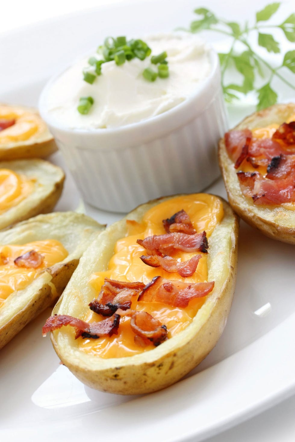 <p>Let guests choose what they fancy—and sit back and enjoy some football. Just create a tasty base with baked potatoes and sour cream, then let everyone fill their own with assorted toppings.</p>
<p>Get the recipe at <a href="http://glutenfreerecipebox.com/gluten-free-potato-skins/">Carla's Gluten Free Recipe Box</a>.</p>