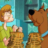 <b>First Taste</b>: <i>Scooby-Doo, Where Are You?</i><br />
<p>The goofy Great Dane Scooby-Doo would do just about anything for one of his eponymous snacks. Those meddling kids often used these treats as the ultimate bribe, sending Scooby and his perennial partner, Shaggy, out as bait for the villain. Rut-roh!</p>

<p><b>Recipe: </b> Approximate your own Scooby Snacks with these easy treats, fit for man or beast. <a href="/recipefinder/no-bake-cookies-recipe-5368"><b>No-Bake Cookies</b></a></p>