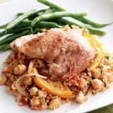 <p>This cinnamon- and cumin-spiked couscous with chicken takes its inspiration from Morocco. It's made mostly with pantry staples — all you have to pick up is some chicken thighs, a bunch of cilantro, and an orange. The orange slices become tender after cooking — you can eat them skin and all. For a variation, substitute diced, boneless leg of lamb for the chicken. Serve with steamed green beans or a spinach salad.</p><p><b>Recipe:</b> <a href="/recipefinder/orange-tomato-couscous-chicken-recipe-ew0311"><b>Orange-Tomato Couscous with Chicken</b></a></p>