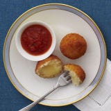 Don't Crowd the Pan <p>Whether you're pan-frying or deep-frying, giving your foods enough space in the pan is a vital (and simple!) trick to know. Though it's tempting, especially when deep-frying, to dump all of your food in the pot at once, resist the urge. Dropping any amount of food into your hot oil will bring down the temperature a little bit, and the oil needs what is called "recovery time," both when food is added and between batches, in order to rise again to the proper cooking temperature, which is generally between 340 degrees F and 375 degrees F. The smaller the amount of food you add to the pot, the less the temperature will drop and the less time oil will need to reheat. Also, adding only a few pieces of food at a time ensures that items don't clump or stick together, and allows them to get a lovely even golden brown color all over.</p><p><b>Recipe:</b> <a href="/recipefinder/mini-arancini-recipe-rbk1211"><b>Mini Arancini</b></a></p>