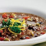 <p>Not your Irish grandmother's stew, this version was inspired by flavors from the south of France: figs, green olives, and herbes de Provence. To shorten the cooking time, we use ground lamb.</p><br /><p><b>Recipe:</b> <a href="/recipefinder/lamb-fig-olive-stew-for-two-recipe" target="_blank"><b>Lamb, Fig, and Olive Stew for Two</b></a></p>