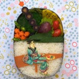 An artfully made bento features a woman in a traditional kimono made of cheese!