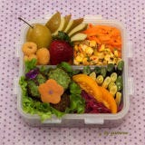 Falafel and corn and carrot salads are vibrant counterparts to fruits and veggies.