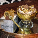 <p>New York is no stranger to the outlandish, but come on, hot chocolate?! Oh yes, say the folks at Serendipity, where they have topped this $25,000 hot chocolate with  the most expensive chocolate in the world (La Madeline au Truffle from Knipschildt Chocolaltier at $2,600 per pound). It's made from a "secret" blend of 14 cocoas and another 14 "rare" and "exotic" cocoas such as Noble Salmwood, Royal Mahogany, Antique Coaba, and Maya Goldfrom. It's served in a goblet lined in edible gold with a crown of 18K gold and 1 carat of pure white diamonds (that can be used as a bracelet) created by Euphoria New York. There's more: it's covered in whipped cream covered in 23K gold, and eaten with a solid 18K 98 gram spoon encrusted with 3 carats of black, white, and chocolate diamonds from said jewelers. Our question: Should we eat this or preserve it in a museum?</p><p><a href="http://serendipity3.com" target="_blank"><i>serendipity3.com</i></a></p>