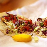<p>Newport native Thomas Carson grew up working on fishing boats; now he runs this fish market renowned for its fresh seafood and stellar fish tacos. Diners have a choice between the signature panko-crusted Basa (an Asian catfish) and a selection from the fish counter, including scallops and wahoo from Baja. For heat seekers, Sriracha and Indonesian sambal complement the mayo-based house sauce.</p><p><a href="http://www.newport.bearflagfishco.com" target="_blank"><i>newport.bearflagfishco.com</i></a></p>