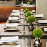 <p><strong>Paul Liebrandt</strong> may never live down his grandstanding days, during which he pulled stunts like having guests dine in total darkness. But after proving how serious a chef he is at <a href="http://www.esquire.com/features/food-drink/best-new-restaurants-2009/corton-new-york" target="_blank">Corton</a> for the last five years, he now has shown himself to be a masterful avatar of what modern cuisine truly is. At the Elm, in Williamsburg, Brooklyn—heart of Hipsterville, America—Liebrandt has stripped down his historically high-flying cuisine. His dishes are sleeker, the elements on the plate fewer.</p>

<p>The short menu has four categories: Raw, Sea, Land, and Share. The last includes dishes meant for two, priced between $48 and $56; most others cost about $20. The dining room, down a flight of stairs but with sufficient glass to see outside, has a cool coffee-shop look, with an open kitchen and lighting soft enough to make everyone look good.</p>

<p>It's a local clientele—Rag & Bone boots, Warby Parker glasses—and they come here not just to get something to eat but for <em>cooking</em>. Liebrandt's cuisine is about classic good taste embellished with whimsy: a two-inch-round foie-gras terrine comes with a spiced strawberry gelée, tiny pickled strawberries, and ginger. And his homage to chicken Kiev is a marvel: a juicy, seasoned chicken breast that, when cut into, floods forth a gush of butter. Such triumphs are the result of the intellect going beyond the sensational in search of true excellence.</p>

<p><em>160 North Twelfth Street; 718-218-1088; <a href="http://www.theelmnyc.com/" target="_blank">theelmnyc.com</a></em></p>