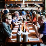 Rolf and Daughters, Nashville <p><strong>Everything about</strong> Rolf and Daughters is suffused with gentle southern understatement. Its Web site tells "a little bit about us," saying it's really a "neighborhood restaurant" in the historic Werthan factory in Germantown that "takes reservations for dinner by phone, you can leave a message and we will call you back to confirm," and that they're "humbled and superexcited to be a part of what's happening right now in Nashville." The site doesn't even give the name of the shy owner, Philip Rolf Krajeck, who says he cooks "modern peasant food." What that actually means: tender heritage chicken with lemon and soft, sweet garlic; fabulously rustic pastas, like gemelli with hen-of-the-woods mushrooms, black kale, and Parmesan; and generous meatballs with a pungent gremolata (crushed garlic, lemon peel, and parsley). Or a simple plate of heritage country ham sliced thin on chewy sourdough toast with pretty little local radishes.</p>
<p>The vibe extends to handcrafted communal tables and the way walk-ins are cordially greeted. There is a bona fide industrial cast to the space, a former boiler room: worn brick and heavy metal framing and a lumberyard of reclaimed wood on the ceiling. It all fits together at Rolf and Daughters, an exemplar of the kind of excellence now found in great southern cities like Nashville.</p>
<p><em>700 Taylor Street; 615-866-9897; <a href="http://www.rolfanddaughters.com/" target="_blank">rolfanddaughters.com</a></em></p>