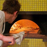 Sotto; Los Angeles Sotto's massive, vibrant-yellow-tiled oven burns only white oak, and reaches more than 900 degrees. It was built onsite over the course of one week by the legendary Stefano Ferrara, a third-generation Neapolitan oven maker, and an assistant. The oven's incredibly specific internal measurements, which are kept a trade secret, help generate the heat that allows crispy-crusted pizzas to cook in less than a minute. Must try: The ultra-creamy guanciale: house-cured pork cheek, ricotta, scallions and a dusting of fennel pollen.
<br /><br />
<a href="sottorestaurant.com" target="_blank">sottorestaurant.com</a>