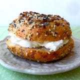 <p>Who needs to run to the bakery when you can prep a batch of fresh bagels yourself on Sunday morning?</p>
<p><em>To make:</em><br />1. Preheat oven to 450 degrees F. Fill 5-quart saucepot halfway with water. Cover and heat to boiling on high.<br />
   2. Meanwhile, on large plate, combine 3 Tablespoons sesame seeds, 3 Tablespoons dried onion flakes, 3 Tablespoons poppy seeds, and 2 Tablespoons coarse sea salt.<br />
    3. Shape a handful of dough into 8-inch-long rope and pinch ends together to form circle; place on parchment-lined cookie sheet. Repeat with remaining dough.<br />
    4. Gently lower into hot water as many rounds as will comfortably fit into pot (about 6). Boil 2 minutes, flipping occasionally.<br />
    5. With slotted spoon, working with one at a time, transfer to plate with seeds, pressing for seeds to adhere. Transfer to same cookie sheet, seeds-side up. Repeat with remaining dough rounds.<br />
    6. Bake 20 minutes or until deep golden brown. Cool slightly. Serve warm or let cool completely and toast before serving.</p>