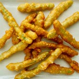 <p>The bubbles in the beer help the batter get poofy and delicately crisp. Think of this as a cross between tempura and British fish-and-chips.

To make it: In a small bowl, whisk together 1/4 cup soy sauce, 2 tablespoons rice or white vinegar, 1 tablespoon water, 1 tablespoon toasted sesame oil, and 1 tablespoon sugar. In 5-quart saucepot, heat 1 quart vegetable oil on medium-high until hot but not smoking (350°F). Meanwhile, in large bowl, combine 1 1/4 cups all-purpose flour, 3 tablespoon sesame seeds, 1/2 teaspoon baking powder, and 1/2 teaspoon baking soda. Using fork or small spatula, slowly swirl 1 cup beer into flour, stirring until mostly combined with some sm. lumps remaining (over stirring will deflate your batter). Your oil is ready when you add a droplet of batter and it sizzles on contact instead of sinking to the bottom.

Working in batches, take a handful of trimmed green beans (you'll need 8 oz. total) and add them to the batter, swirling them around to coat. Using your hands, while messy, is the easiest way to handle them. Pick beans up, allowing excess batter to drip back into bowl, then gently lay them in the hot oil. Cook 3 to 5 minutes or until deep golden brown, stirring frequently. It's okay if some of the beans stick together. With slotted spoon, transfer green beans to paper-towel-lined platter. Serve immediately with dipping sauce. Continue frying next few batches. Serves 4 to 6.</p>