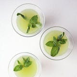 <p>Rather than just plopping an herbal garnish directly into the glass, firmly clap (also known as spank) the sprig of herbs between two hands; this helps to release the herbs' aromatic oils without being so rough as to bruise and discolor the garnish. </p>