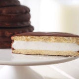 Moon Pie <p>Put the globe aside. You need a picture of the solar system to find the place that inspired the name for this wonderful treat. Chattanooga Bakery created the <a href="http://www.moonpie.com/" target="_blank">MoonPie</a> in 1917. When a bakery salesman from the company visited a store that catered to coal miners, the miners said they needed a solid, filling snack to munch on when they couldn't stop for lunch. When the salesman asked how big it should be, a miner framed the moon with his hands. Thus the resulting treat — marshmallow sandwiched between two graham cookies coated in chocolate — earned its name: MoonPie.</p><br />
<p><b>Try These Homemade Recipes: </b><br />
<a href="/recipes/cooking-recipes/sandwich-cookies"><b>Sandwich Cookie Recipes</b></a></p>