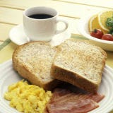 <p>The Texas Toast tale is set in Texas. One of the more widely accepted invention stories takes place in 1941, when Pig Stand, a successful restaurant chain in the state, put in a bakery order for thicker slices of bread. When those pieces wouldn't fit in the toaster, the story goes, a cook suggested covering them with butter and grilling them. Texas Toast became a hit. Today, the thick slices have made their way into the prepacked world thanks for grocery store freezers.</p><br />
<p><b>Try These Homemade Recipes: </b><br />
<a href="/recipefinder/texas-toasts-filet-mignon-watercress-herb-butter-recipe-5529"><b>Texas Toasts with Filet Mignon, Watercress, and Herb Butter</b></a></p>