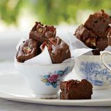 <p>Kat Kinsman tops her rich brownies with bacon and pecans. To enhance the smoky flavor, she mixes some of the bacon fat into the batter.</p><p><b>Recipe: </b><a href="http://www.delish.com/recipefinder/bacon-bourbon-brownies-pecans-recipe-fw0811" target="_blank"><b>Bacon-Bourbon Brownies with Pecans</b></a></p>