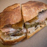<p>If you've ever been to Italy, you may have sampled a sandwich stuffed with perfectly roasted pork from a whole roasted pig. Expert chef Sarah Jenkins decided that was the singular Italian street food she wanted to offer New Yorkers. Her restaurant, aptly named <a href="http://www.porchettanyc.com/" target="_blank">Porchetta</a>  (pronounced por-ketta), showcases the porcine at its best featuring succulent, meltingly tender, moist roast pork loin topped off with chunks of the rich and fatty belly <i>and</i> crispy cracklings distinguishing it from any other run-of-the-mill sandwich. Tip: If you want to forgo the bread get the porchetta plate. It's pork perfection.</p><br />

<p><b>Try these supreme sandwiches tonight:</b> <a href="/cooking-shows/food-tv/celebrity-chef-sandwiches" target="_blank">Fresh Twists: Celebrity Chefs' Spin on Sandwiches</a>.</p>