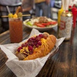 <p>Whether at a baseball game or backyard barbecue, summer cannot be considered summer without eating a few hot dogs. But while we love a good street cart frank or charred weiner from the stadium, these weiner-centric spots have dog designs that definitely deserve a bite.</p>
<p><b>Austin, TX:</b> <a href="http://www.hotdogscoldbeer.com/" target="_blank">Frank's</a> Texalina — a locally produced pork and beef sausage topped with grilled coleslaw, Carolina mustard BBQ sauce, and white Cheddar cheese.</p>
<p><b>New York, NY:</b> <a href="http://www.crifdogs.com/" target="_blank">Crif Dogs's</a> Spicy Red Neck — a bacon-wrapped frankfuter topped with chili, cole slaw and jalapeños.</p>
<p><b>Brooklyn, NY:</b> <a href="http://www.barkhotdogs.com/" target="_blank">Bark Hot Dogs</a> Classic pan griddled featuring their own private label dog.</p>
<p><b>Fairfield, CT:</b> <a href="http://www.superduperweenie.com/" target="_blank">Super Duper Weenie's</a> smoky New Englander — sauerkraut, bacon, mustard, sweet relish and raw onion.</p>
<p><b>Chicago, IL:</b> <a href="http://hotdougs.com/" target="_blank">Hot Doug's</a> Chicago-style — all-beef frankfurter cushioned by a poppy seed bun topped with chopped white onions, sweet pickle relish, dill pickles, tomatoes, sport peppers, and yellow mustard.</p>
<br /><p><b>Try these versions tonight:</b> <a href="/entertaining-ideas/parties/barbecue-grilling/hot-dog-recipes-toppings-del0510" target="_blank">Totally Tubular: Hot Dog Recipes and Toppings</a>.</p>