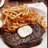 <p><b>Location:</b> New York, NY<br />
<b>Website:</b> <a href="http://www.balthazarny.com/" target="_blank">balthazarny.com</a><br />
<b>On the Menu:</b> Pommes Frites</p><br />

<p>Balthazar's French fries, which are served as a side with sandwiches and steak (pictured here), don't have any fancy spices or toppings. But some people think they're the best thing on the plate. One of their biggest fans is chef Bobby Flay, who said, "The fries at Balthazar are unbelievably perfect," on an episode of "The Best Thing I Ever Ate: Totally Fried."</p><br />

<p>The sliced potatoes are treated with utmost care at the restaurant. They use Idaho russet potatoes that are peeled, cut, soaked in water overnight (to wash out excess starch), blanched in 100% peanut oil, then cooled and refrigerated until needed. When an oder comes up, the fries are cooked in super-hot oll and served golden brown and crispy, with some salt, to awaiting patrons.</p>