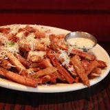 <p><b>Location:</b> Chicago, IL<br />
<b>Website:</b> <a href="http://www.dmkburgerbar.com/" target="_blank">dmkburgerbar.com</a><br />
<b>On the Menu:</b> Parmesan Truffle Fries</p><br />

<p>Want to try an indulgent fry? DMK's Parmesan Truffle fries start as simple Idaho or Washington russet potates that are aged, scrubbed, sliced, and rinsed in cold water. They're blanched in beef fat, drained, and stored at room temperature. The fries are fried crisp when an order comes up and seasoned with salt and pepper. Then the magic happens. They're topped with Parmigiano Reggiano and served with a white truffle oil.</p><br />

<p>If Parmesan and truffle oil don't get your mouth watering, consider one of the other fry options: Sea Salt & Black Pepper with House Ketchup, Sweet Potato Fries with Lemon Tobasco Aioli, Wisconsin Cheddar & Scallion, Amish Blue & Smoked Bacon, or Gravy.</p>