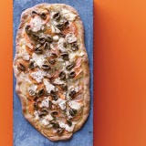 <p>American farmers harvest more than a million acres of potatoes each year, making it the country's top vegetable crop. Both the sweet and white kinds appear along with olives and feta on the flatbread here, which is baked until the edges of the potatoes crisp and the cheese starts to melt.</p>
<p><strong>Recipe:</strong> <a href="../../../recipefinder/two-potato-flatbread-olives-feta-recipe-fw0911" target="_blank"><strong>Two-Potato Flatbread with Olives and Feta</strong></a></p>