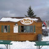 <p><b>Location:</b> On the slopes of Vermont, New Hampshire, New York, and Massachusetts</p><p><b>What You'll Find:</b> OK, so it's not actually a drive-thru; the <a href="http://wafflecabin.com/locations/vermont/okemo" target="_blank">Waffle Cabin</a> is a ski-thru. For ski bums on the go who don't have time between mogul runs to sit down and unbuckle, the small, mountainside log cabin serves up freshly made waffles dusted with extra sweet sugar.</p>