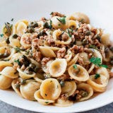 <p>"The sauce fits the pasta," said judge Marc Vetri of the <a href="http://www.foodandwine.com/articles/judges-choice-best-food-and-wine-pasta" target="_blank">Best Pasta Poll on FoodandWine.com</a> in praise of this tender veal ragù flavored with white wine, capers, thyme, and rosemary, then tossed with the little ear-shaped orecchiette. "The meat, the capers — they hang on to the pasta when you lift up your fork."</p>
<p><strong>Recipe:</strong> <a href="/recipefinder/orecchiette-veal-capers-white-wine-recipe" target="_blank"><strong>Orecchiette with Veal, Capers, and White Wine</strong></a></p>