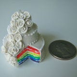 <b>The Artist:</b> Jessica Hlavac, <a href="http://imsotiny.com/" target="_blank">i'm so tiny</a><br /><br />

After New York state legalized gay marriage earlier this year, Jessica Hlavac made this super-small wedding cake (it was her first and, so far, only chance to use neon clay she had on hand). But cake isn't her only mini creation. She's made eats in lots of food categories, including appetizers, breakfast, and sandwiches.