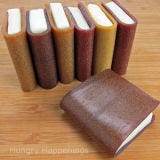 <b>The Artist:</b> Beth Jackson Klosterboer, <a href="http://www.hungryhappenings.com/" target="_blank">Hungry Happenings</a><br /><br />

If all books were this sweet, there would probably be more avid readers. Beth Jackson Klosterboer, who has worked as a chocolatier, event planner, and candy shop owner, made these books out of completely edible fruit leather and honey-scented white modeling chocolate. But they're just a bite-sized snack: 1 1/2 inches x 1 7/8 inches. Want to take a stab at making your own edible books? Follow her <a href="http://www.hungryhappenings.com/2011/05/how-to-create-school-books-using-corn.html" target="_blank">tutorial</a>.