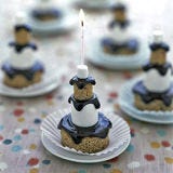 <b>The Artist:</b> Martha Stewart<br /><br />

Homemade graham-flavored mini cakes support this tiered dessert structure dripping with semisweet chocolate glaze. These desserts make great kids' birthday cakes for adventurous eaters.<br /><br />

Want to learn how to make these and other small sweets? Check out our collection of <a href="/recipes/cooking-recipes/mini-desserts">mini desserts from Martha Stewart</a>.