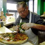 <p><b>Signature Item</b>: Plain pie.<br />

72-year-old owner Domenico DeMarco makes all the pies at this Brooklyn pizza mecca, so they come out with the perfect balance of tomato sauce (made fresh daily), mozzarella and Grana Padano cheeses. A Di Fara spin-off called Tagliare opened in LaGuardia Airport in the fall of 2010. <a href="http://www.difara.com" target="_blank">difara.com</a>.</p>