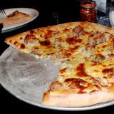 <p><b>Signature Item</b>: Homemade Sausage Pie.<br />

This super traditional pizzeria, with wood paneled walls covered with pictures of famous athletes, has been around for more than a century. <a href="http://www.santarpiospizza.com" target="_blank"> santarpiospizza.com</a>.</p>