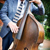 <p>Since you're not at the dance party yet, keep the volume turned down so people can easily talk. This doesn't mean you have to play Michael Bolton, but matching your music to the mood is a good idea.</p><br /> 
<p><b>Top-Shelf Idea</b>: Maybe you've planned on having a rocking DJ to keep you dancing throughout the reception, but for the cocktail hour, slow it down. Hire a jazz trio, quartet or acoustic guitarist to set a distinct mood.</p>
