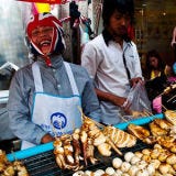 <p>The ultimate tourist destination for any street-food obsessive, Bangkok boasts thriving markets throughout the city, with some of the most robustly-flavored street snacks coming from neon-lit Yaowarat Road in the city's Chinatown. Here, makeshift stands offer pork skewered on sugar canes; fragrant fish curries; sweet bananas deep-fried in rice-flour batter; and durian, the notoriously stinky fruit.</p>