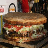 <p>California's Alameda County Fair housed an impressive record-breaking sandwich: a 777-pound burger. The massive burger used 600 pounds of beef and took 14 hours to cook.</p><br />

<a href="/food/recalls-reviews/worlds-biggest-burger-record-breaker"><b>Read the Whole Story</b></a>