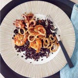 Brazilian Black Rice <p>This dish from Uxua hotel chef Aladim Alves traces its roots to the 1970s, when the beaches of Trancoso, Brazil, were a favorite hippie destination. It combines richly flavored Bahian seafood with healthy whole-grain black rice.</p><p><b>Recipe:</b> <a href="http://gogonow.org/recipefinder/brazilian-black-rice-recipe-fw0810%22 target="_blank"><b>Brazilian Black Rice</b></a></p>