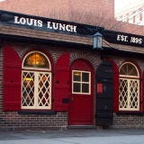Louis Lunch <p><b>Date Opened:</b> 1895</p>
<p><b>Location:</b> New Haven, CT</p>
<p>Legend has it that in 1900, a customer entered this tiny lunch counter and asked for something he could eat on the go. The simple request purportedly led to the creation of the first hamburger in America. Louis's hamburgers aren't much different than they were back then — hand-shaped patties served between toast with cheese, tomato, and onion but <i>never</i> ketchup or mustard. The burgers are even cooked on the original cast-iron grills that date back to 1898.</p>